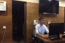 Me at Gran Hotel Delfin reception desk working as a Night Auditor (2022).